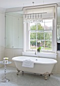 WHITE HOUSE: MASTER BATHROOM - CREAM WITH MARBLE FLOORS  WHITE ROLL TOP BATH.