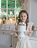 WHITE HOUSE: KITCHEN - GIRL WITH WHITE ICED SKATING CAKE