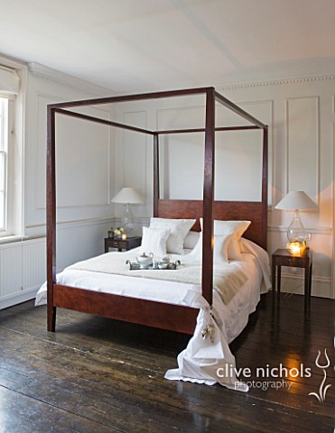 WHITE_HOUSE_MASTER_BEDROOM__WHITE_WITH_DARK_WOODEN_FLOORS__WOODEN_CONTEMPORARY_FOUR_POSTER_BED_DRESS