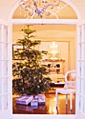 WHITE HOUSE: VIEW THROUGH DOUBLE FRENCH DOORS INTO LIVING ROOM - CHRISTMAS TREE AND PRESENTS