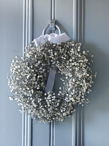 WHITE_HOUSE_PALE_GREY_FRONT_DOOR_DECORATED_WITH_WHITE_GYPSOPHILA_CHRISTMAS_WREATH