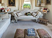 SARAH BAKERS HOUSE  THE OLD VICARAGE  SOMERSET: SITTING ROOM; CREAM DÉCOR  WITH VINTAGE FINDS AND TRAVEL TREASURES. SETTEE
