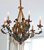 SARAH BAKERS HOUSE  THE OLD VICARAGE  SOMERSET: SITTING ROOM; VINTAGE METAL CEILING CANDELABRA IN GREEN RED AND GOLD.