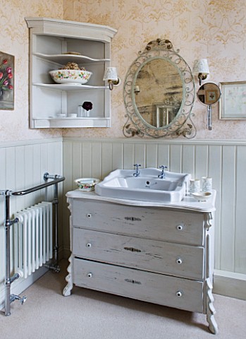 SARAH_BAKERS_HOUSE__THE_OLD_VICARAGE_BATHROOM__SINK_SET_IN_FREE_STANDING_VINTAGE_SET_OF_DRAWERS_WITH