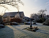 FROST COVERED ROSE GARDEN WITH SUNDIAL AND DUTCH BARN C.1700 WOLLERTON OLD HALL  SHROPSHIRE.