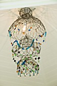 CHELSEA 2012 - CHANDELIER BMADE FROM OLD WIRE GARDEN HANGING BASKETS BY ANNABEL LEWIS