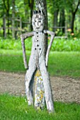 CHATEAU DU RIVAU  LOIRE VALLEY  FRANCE: WOODEN FIGURE BY TREE IN WOODLAND