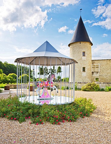 CHATEAU_DU_RIVAU__LOIRE_VALLEY__FRANCE_THE_CENTRAL_COURTYARD_WITH_MERRY_GO_ROUND_BY_PIERRE_ARDOUVIN_