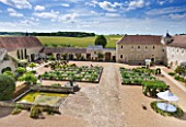CHATEAU DU RIVAU  LOIRE VALLEY  FRANCE: VIEW FROM THE CHATEAU ACROSS THE CENTRAL COURTYARD AND POTAGER TO THE STABLES AND FIELDS BEYOND