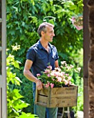 LES JARDINS DE ROQUELIN  LOIRE VALLEY  FRANCE: STEPHANE CHASSINE WITH A BOX OF ROSA THE FAIRY