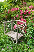 LES JARDINS DE ROQUELIN  LOIRE VALLEY  FRANCE: CHESTNUT WOODEN CHAIR BY STEPHANE CHASSINE WITH ROSA MARIA LISA