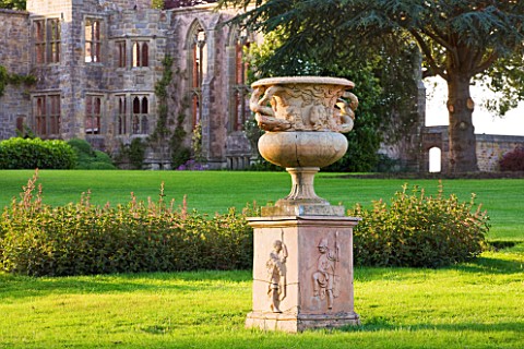 NYMANS__SUSSEX_THE_NATIONAL_TRUST_URN_ON_MAIN_LAWN_WITH_THE_HOUSE_BEHIND__EVENING_LIGHT__JUNE