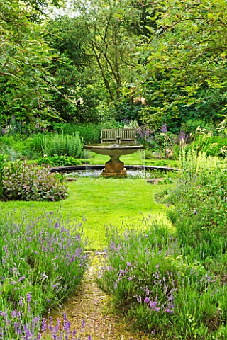 OLD_THATCH__BERKSHIRE_THE_LAVENDER_TERRACE_WITH_LAWN_AND_WATER_GARDEN_WITH_FOUNTAIN_BEYOND