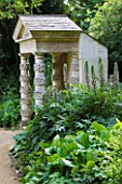 PAINSWICK ROCOCO GARDEN  GLOUCESTERSHIRE: FOLLY WITH ACANTHUS