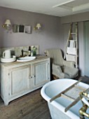 TWIG HUTCHINSON HOUSE  LONDON: BATHROOM WITH SINK AND CABINET - WOODEN LADDER AGAINST WALL