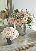 TWIG HUTCHINSON HOUSE  LONDON: METAL CONTAINERS ON SIDEBOARD WITH ROSES AND MIRROR BEHIND