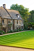 WORCESTER COLLEGE  OXFORD: THE FRONT QUADRANGLE WITH MEDIEVAL COTTAGES AND LAWN WITH STRIPES