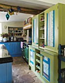 VELVET ECCENTRIC: HAND PAINTED FAMILY KITCHEN - MARBLE WORKTOP  GREEN CUPBOARD FINISHED WITH INDIAN HAND-MADE PAPER