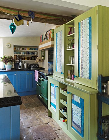 VELVET_ECCENTRIC_HAND_PAINTED_FAMILY_KITCHEN__MARBLE_WORKTOP__GREEN_CUPBOARD_FINISHED_WITH_INDIAN_HA