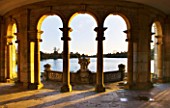 HEVER CASTLE  KENT  AUTUMN: THE ITALIAN GARDENS AT DAWN - LOOKING OUT TO THE LAKE FROM THE LOGGIA