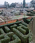 HAMPTON COURT CASTLE AND GARDENS  HEREFORDSHIRE: VIEW FROM THE GOTHIC TOWER ACROSS THE YEW MAZE TO THE WALLED GARDEN IN FROST WITH THE ISLAND PAVILIONS AND COURT BEHIND
