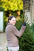 THE GARDEN AND PLANT COMPANY  HATHEROP  GLOUCESTERSHIRE: EMILY TAKING HER TREE HOME FOR CHRISTMAS