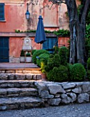 LA CASELLA, FRANCE: STEPS TO FRONT OF HOUSE WITH ROCKS, BOX BALLS, TERRACE, FOUNTAIN, WALL, MEDITERRANEAN, BUXUS, PATIO, GREEN, FOLIAGE, SPHERES, FORMAL