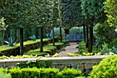 LA CASELLA, FRANCE: PATH, VISTA, CLIPPED, TOPIARY, MEDITERRANEAN, FRENCH, FORMAL, GREEN, EVERGREENS, SUMMER, PROVENCE, HEDGES, HEDGING, BOX, BUXUS, BLUE, SEAT, BENCH, AGAVES
