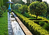 LA CASELLA, FRANCE: CANAL, RILL, WATER, FOUNTAINS, CLIPPED, TOPIARY, MEDITERRANEAN, FRENCH, FORMAL, GREEN, EVERGREENS, SUMMER, PROVENCE, HEDGES, HEDGING, BOX, BUXUS, SEAT, COVERED
