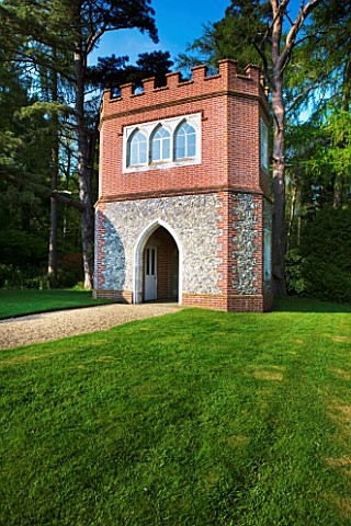 DODDINGTON_PLACE_GARDENS__KENT_SPRING_GRAVEL_PATH_AND_FLINT_AND_BRICK_FOLLY_BUILT_IN_1998_IN_MEMORY_