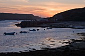 THE ISLES OF SCILLY: THE HARBOUR AT TRESCO AT SUNSET