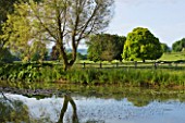 GLYNDEBOURNE, EAST SUSSEX: VIEW ACROSS LAKE TO THE COUNTRYSIDE BEYOND - WATER, POOL, TRANQUIL, PEACEFUL, COUNTRY GARDEN, LANDSCAPE