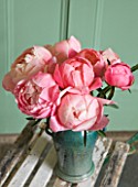 JO BENNISON PEONIES  LINCOLNSHIRE: VASE ON CHAIR WITH PEONY CORAL CHARM