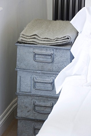 RICHARD_CARNILL_HOUSE__NOTTINGHAMSHIRE_MASTER_BEDROOM_ZINC_CRATES_FROM_BAILEYS_HOME_AND_GARDEN_WOOL_