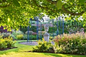 SLEDMERE HOUSE GARDEN, YORKSHIRE: CLASSICAL URN ON A PLINTH, BLUE METAL GAZEBO, LAWN, FOCAL POINT, TRADITIONAL, COUNTRY GARDEN, SUMMER, AUGUST, EVENING LIGHT