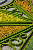 SLEDMERE HOUSE GARDEN, YORKSHIRE: VIEW ONTO ITALIANATE PARTERRE FROM HOUSE WITH MARIGOLDS - CLASSIC, COUNTRY GARDEN, SUMMER, AUGUST, FORMAL, CLIPPED, TRIMMED, TOPIARY, BOX