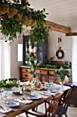 COMMON FARM FLOWERS. SOMERSET: FESTIVE TEA-TIME AT COMMON FARM FLOWERS WITH GARLANDS  WREATHS AND TABLE ARRANGEMENTS ALL MADE FROM BRITISH GROWN FLOWERS AND FOLIAGE IN THE WORKSHOP