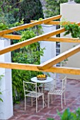 SICILY  ITALY: CASA CUSENI IN TAORMINA - METAL TABLE AND CHAIRS ON PATIO WITH NEW PERGOLA - SHADE  ENTERTAINING  ENTERTAIN  FOOD  EATING  DINING  MEDITERRANEAN