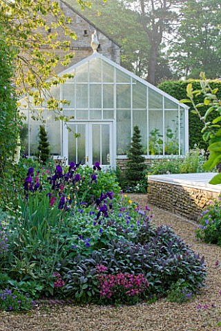 ROCKCLIFFE_HOUSE_GLOUCESTERSHIRE_PURPLE_BORDER_IN_THE_VEGETABLE_GARDEN_WITH_PURPLE_SAGE_AND_IRIS_GER