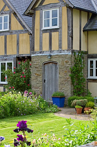 CLAIRE_AUSTIN_HARDY_PLANTS__POWYS___THE_FRONT_OF_THE_HOUSE