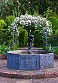 BIRTSMORTON COURT, WORCESTERSHIRE: WHITE GARDEN - LEAD POOL / POND WITH CHERUB FOUNTAIN AND METAL ARCH WITH ROSE SNOWDRIFT. COUNTRY GARDEN, CLASSIC, ENGLISH