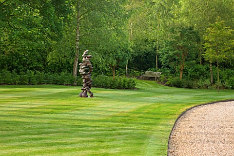POULTON_HOUSE_GARDEN_WILTSHIRE_THE_LAWN_BETWEEN_THE_RILLS_AND_MAIN_DRIVE_WITH_ABSTRACT_BRONZE_SCULPT