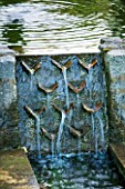 POULTON HOUSE GARDEN, WILTSHIRE: DETAIL OF WATER CASCADING INTO RILL