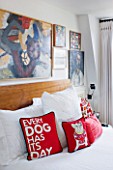 BEN DE LISI HOUSE AND GARDEN  LONDON: MASTER BEDROOM WITH BED AND BEN DE LISI DOG CUSHIONS