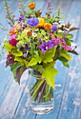 COMMON FARM FLOWERS, SOMERSET, SUMMER: FRESHLY CUT FLOWERS IN GLASS CONTAINER ON BLUE BENCH / TABLE - FLOWER, FLOWERS, BOUQUET, DISPLAY, ARRANGEMENT, FLORAL, GOLDEN HOP, CORNFLOWER