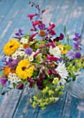 COMMON FARM FLOWERS, SOMERSET, SUMMER: FRESHLY CUT FLOWERS IN GLASS CONTAINER ON BLUE BENCH / TABLE - FLOWER, BOUQUET, DISPLAY, ARRANGEMENT, FLORAL, ALCHEMILLA, PENSTEMON