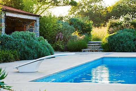 LE_HAUT_GUERNSEY_SWIMMING_POOL_WITH_POOL_HOUSE_AND_STEPS_LEADING_TO_WILDFLOWER_MEADOW