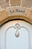 LE HAUT, GUERNSEY: FRONT DOOR WITH LE HAUT WRITTEN ABOVE IT