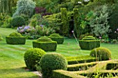 WOOLSTONE MILL HOUSE, OXFORDSHIRE: VIEW FROM FORMAL PARTERRE WITH BOX FONDANTS AND BOX BALLS. GREEN, TOPIARY.