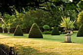 CHENIES MANOR, BUCKINGHAMSHIRE: YEW CONES ON THE LAWN - CLIPPED, TOPIARY, COUNTRY GARDEN, CLASSIC, ROMANTIC